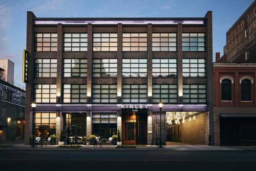 a large brick building with windows on a city street at Kinley Chattanooga Southside, a Tribute Portfolio Hotel in Chattanooga