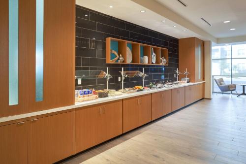 a store with a long line of counters with shoes at SpringHill Suites by Marriott Winter Park in Orlando