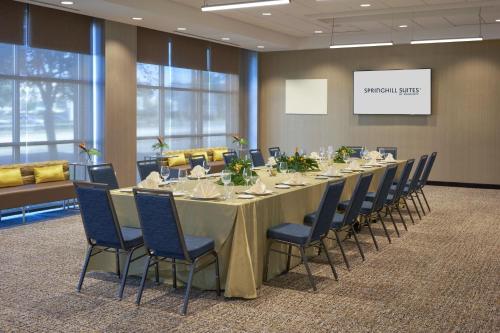 a conference room with a long table and chairs at SpringHill Suites by Marriott Winter Park in Orlando