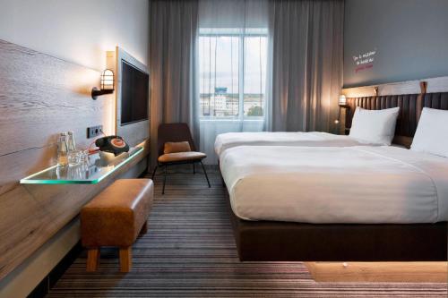 Letto o letti in una camera di Moxy Katowice Airport