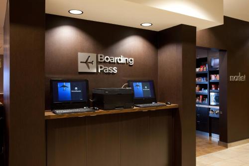a reception desk with two computers on a counter at Courtyard Houston Downtown Convention Center in Houston