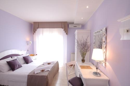 Postel nebo postele na pokoji v ubytování Hotel I Due Cigni