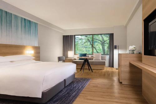 a hotel room with a bed and a desk at Fuji Marriott Hotel Lake Yamanaka in Yamanakako