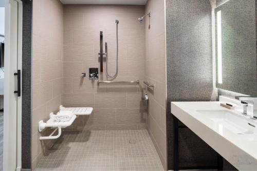 a bathroom with a sink and a shower at Sheraton Flowood The Refuge Hotel & Conference Center in Flowood
