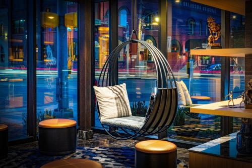 a chair sitting in front of a window at Renaissance Oklahoma City Downtown Bricktown Hotel in Oklahoma City
