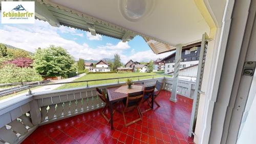 a balcony with a table and chairs on it at Apartment Brigitte Schöndorfer in Strobl