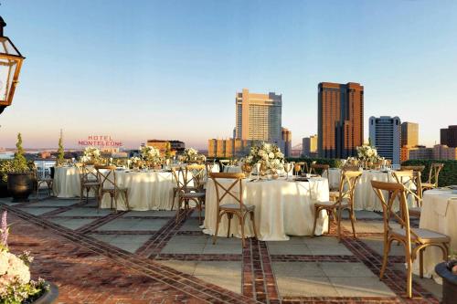 a wedding reception with white tables and chairs and a city at The Ritz-Carlton, New Orleans in New Orleans