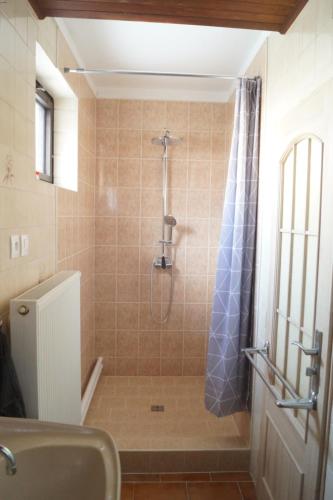 a bathroom with a shower with a shower curtain at Apartmán Pod Kaštany in Bystřice nad Pernštejnem