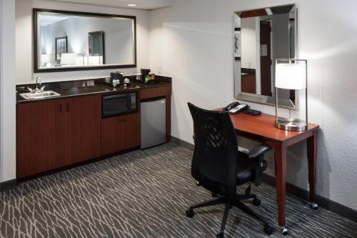 an office with a desk and a chair in a room at Courtyard by Marriott Waco in Waco