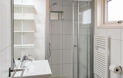 a bathroom with a sink and a shower at Nice Ship In Aalsmeer With Kitchen in Leimuiden