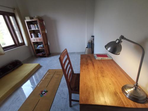 a room with a wooden table and a lamp at Villa by Mountain Homes- Lansdowne in Lansdowne