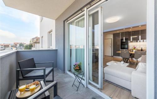 a living room with a couch and a table at Cozy Apartment In Pula With Wifi in Pula