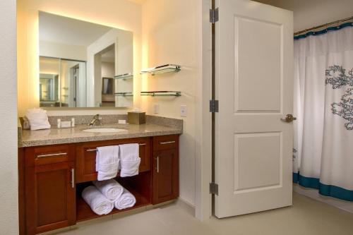 a bathroom with a sink and a mirror at Residence Inn by Marriott Arlington Ballston in Arlington
