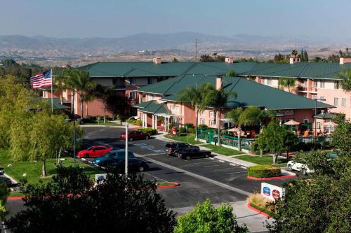 an aerial view of a small town with a parking lot at Residence Inn by Marriott Santa Clarita Valencia in Santa Clarita