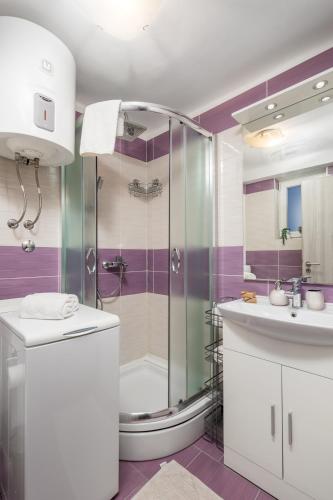 a bathroom with a shower and a sink at Main View Apartment in Rijeka