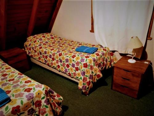 Una cama o camas en una habitación de Complejo Aiken