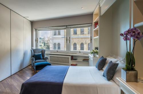 En eller flere senge i et værelse på 47Luxury Suites - Colosseo
