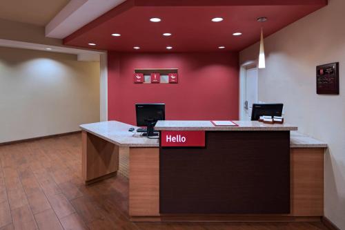 an office lobby with a hello sign on a counter at TownePlace Suites by Marriott Albuquerque North in Albuquerque