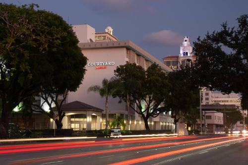 a city street at night with a building at Courtyard Miami Coral Gables in Miami