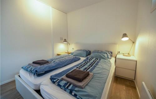 a bedroom with two beds with towels on them at Aqualiving in Aalsmeer