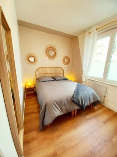 Posteľ alebo postele v izbe v ubytovaní Appartement cozy au centre-ville