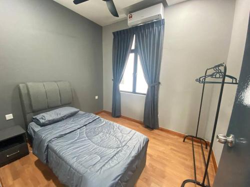 a bedroom with a bed and a window at Paradigm Mall Johor Bahru The Platino 3 Bedroom in Johor Bahru