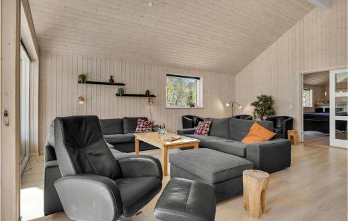 a living room with a couch and chairs and a table at Cozy Home In Vig With Kitchen in Vig
