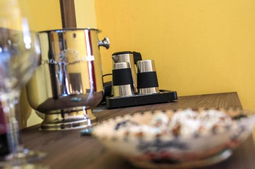 a counter with a food processor and a plate of food at Hotel Miramonti Seulo Turismo Rurale in Seùlo