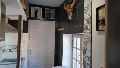 a hallway with a door in a house at Le Studio de la République in Agde