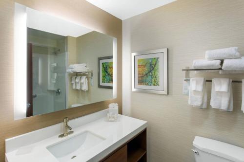 a bathroom with a sink and a mirror at Fairfield Inn & Suites by Marriott Santa Fe in Santa Fe
