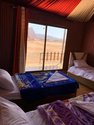 Katil atau katil-katil dalam bilik di Rehana rum luxury camp