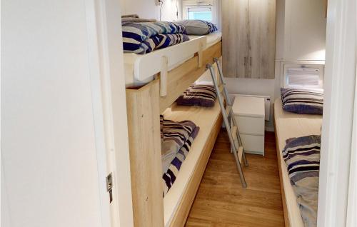 a room with three bunk beds in a room at Awesome Ship In Aalsmeer With Lake View in Aalsmeer