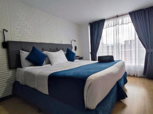 Postel nebo postele na pokoji v ubytování Hotel CGH Bogota Airport