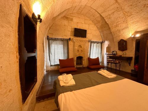 Katil atau katil-katil dalam bilik di Harkasos Cave Hotel