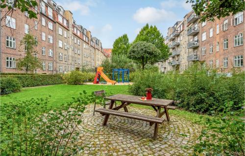 a park with a picnic table and a playground at 1 Bedroom Cozy Apartment In Aarhus C in Aarhus