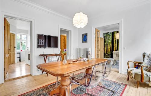a living room with a wooden table and a couch at 1 Bedroom Cozy Apartment In Aarhus C in Aarhus