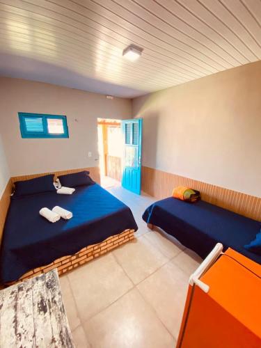 a bedroom with two beds in a room at LagoinhaKitePoint in Tigre