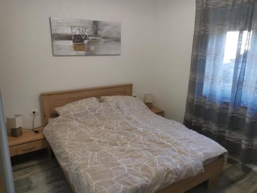 Postel nebo postele na pokoji v ubytování Apartman Marie