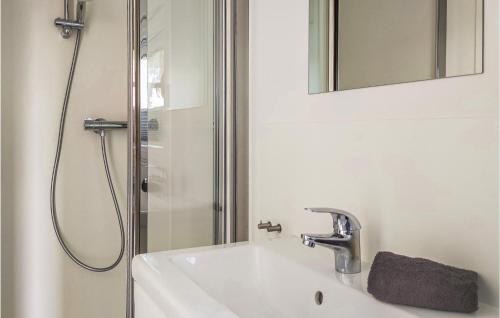 a bathroom with a sink and a shower at Gorgeous Ship In Nieuwpoort With House Sea View in Nieuwpoort
