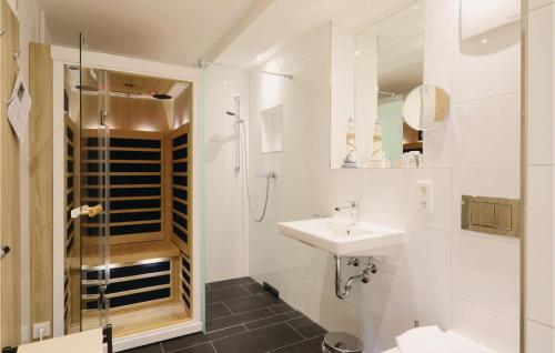 a bathroom with a sink and a shower at Cloud in Binz