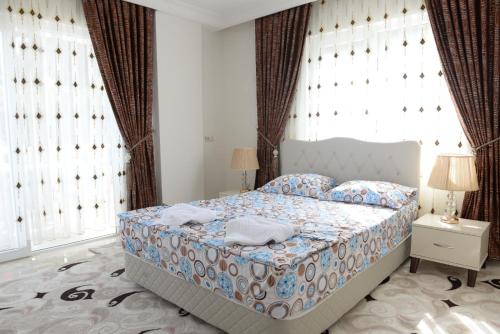 Postel nebo postele na pokoji v ubytování İhsan villas