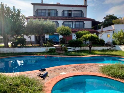 a house with a swimming pool in front of a house at Casa Morello in Zambrone