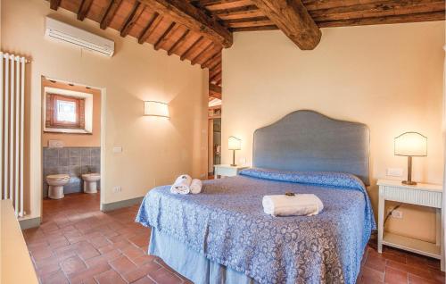 a bedroom with a bed with two towels on it at Casa Roseto in San Donato in Poggio