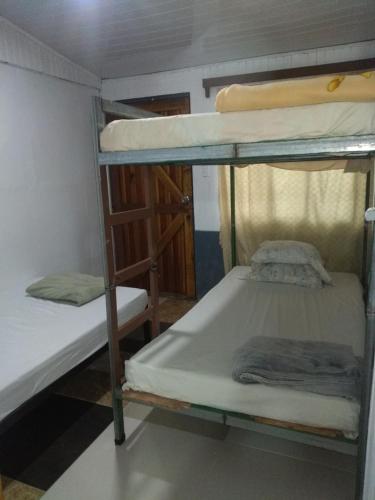 a couple of bunk beds in a room at Hostel Paco House in Monteverde Costa Rica
