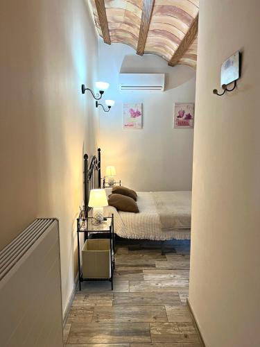 a bedroom with a bed and a table in a room at Mas Segart in Santa María de Palautordera