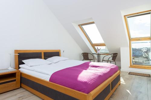 A bed or beds in a room at DreamHouse Apartament „Laguna” ul. Wschodnia 12, Darłówko Wschodnie