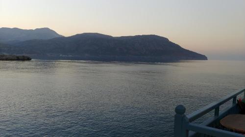 a view of a large body of water with mountains at Sea view in Karpathos Town