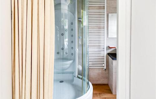 a shower with a glass door in a bathroom at It Soal Waterpark-waterlelie in Workum