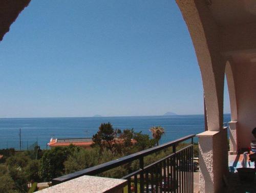 a view of the ocean from a balcony of a house at Residence L'uliveto in Gioiosa Marea