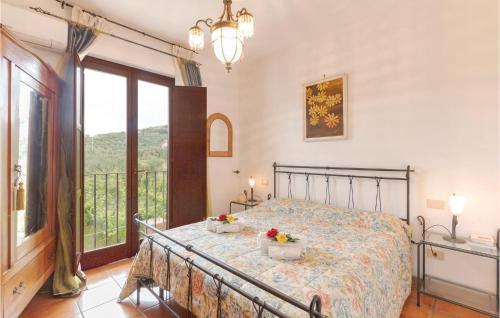 a bedroom with a bed and a balcony at Villa Altea in Itri